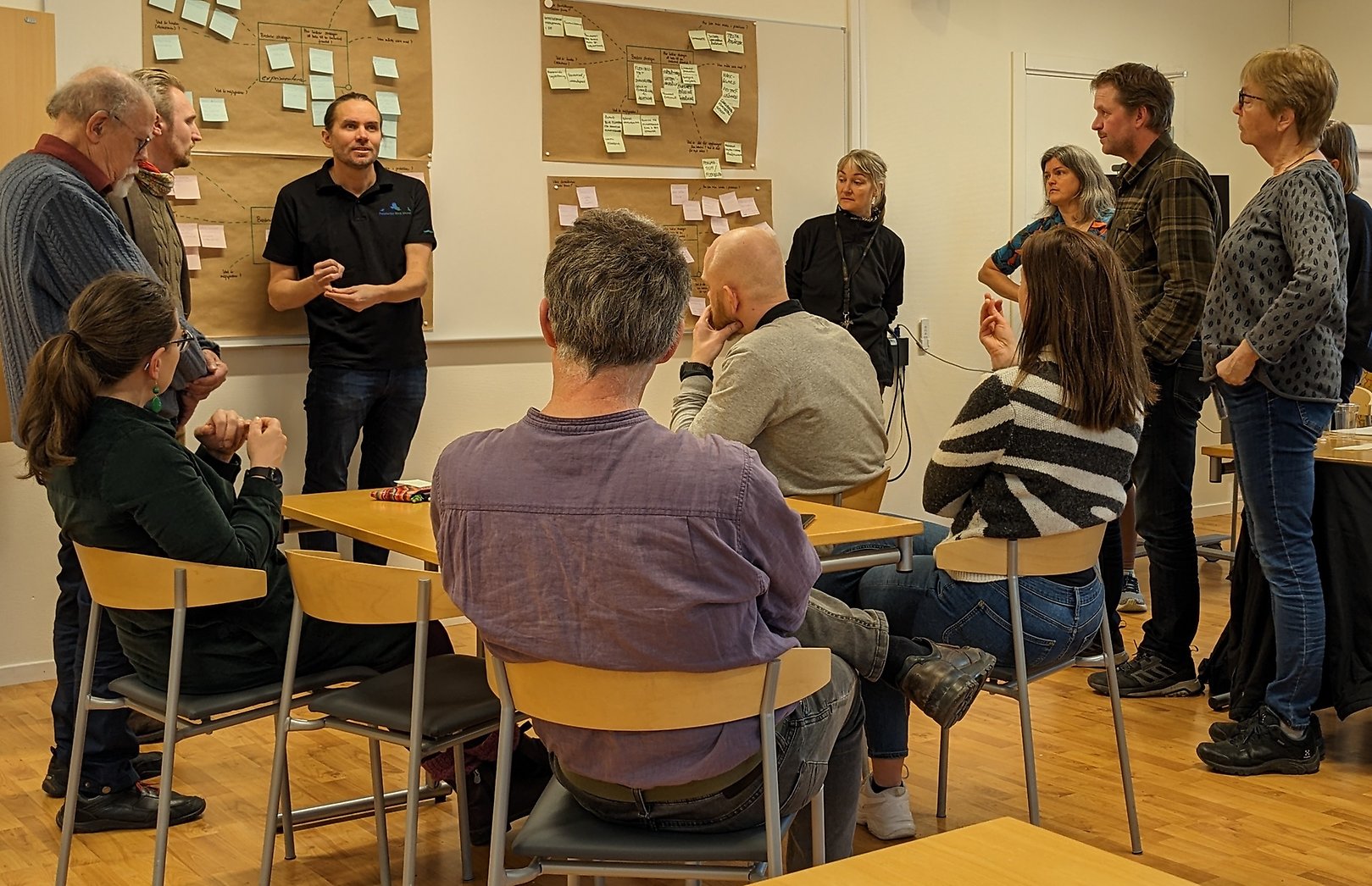 People in a room having a conversation