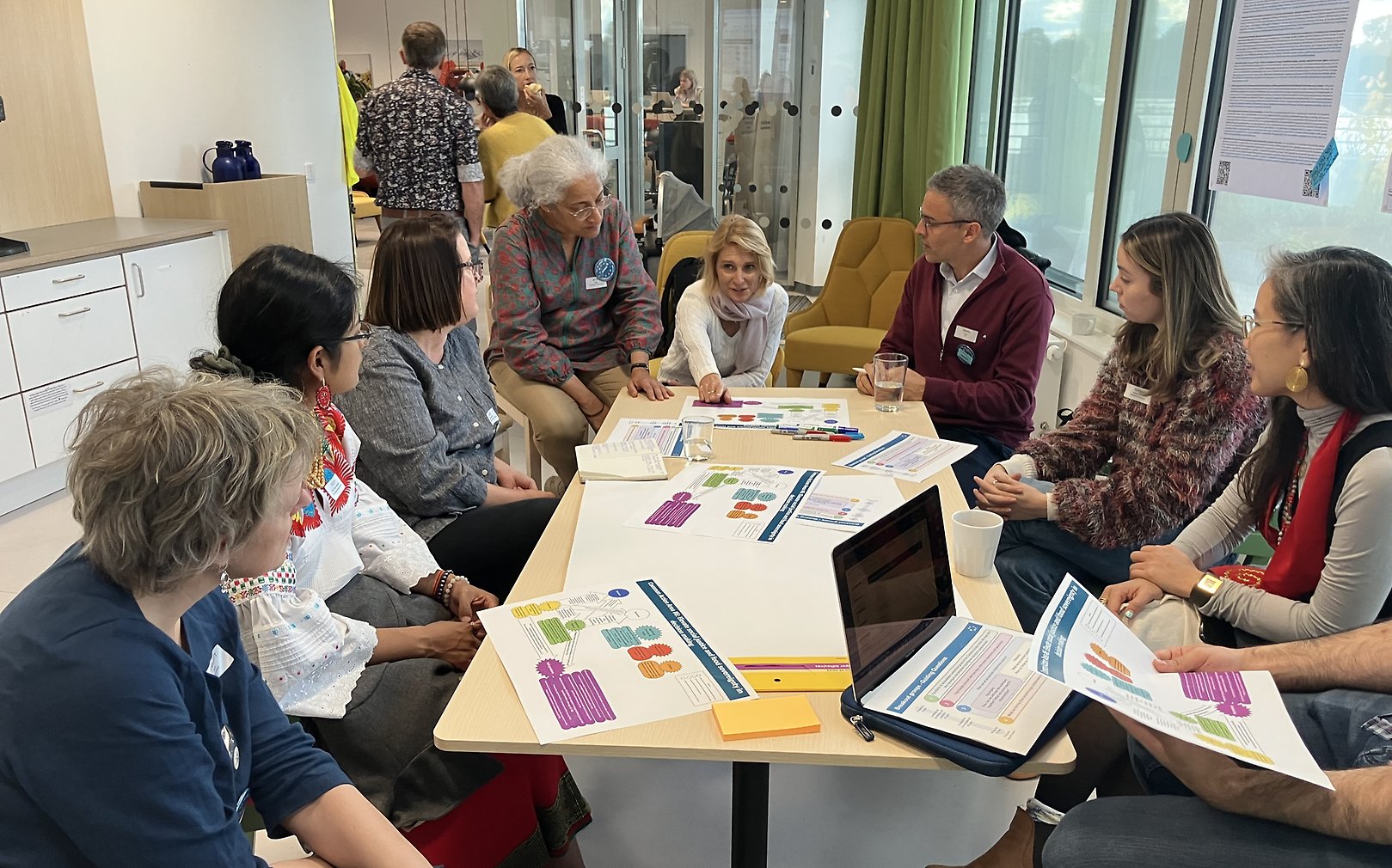 People around a table talking